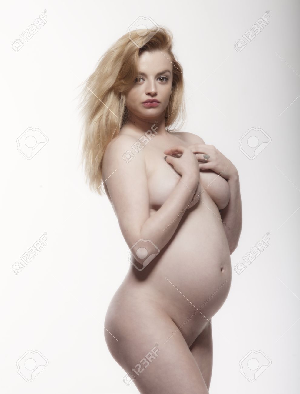 Pregnant blonde woman nude