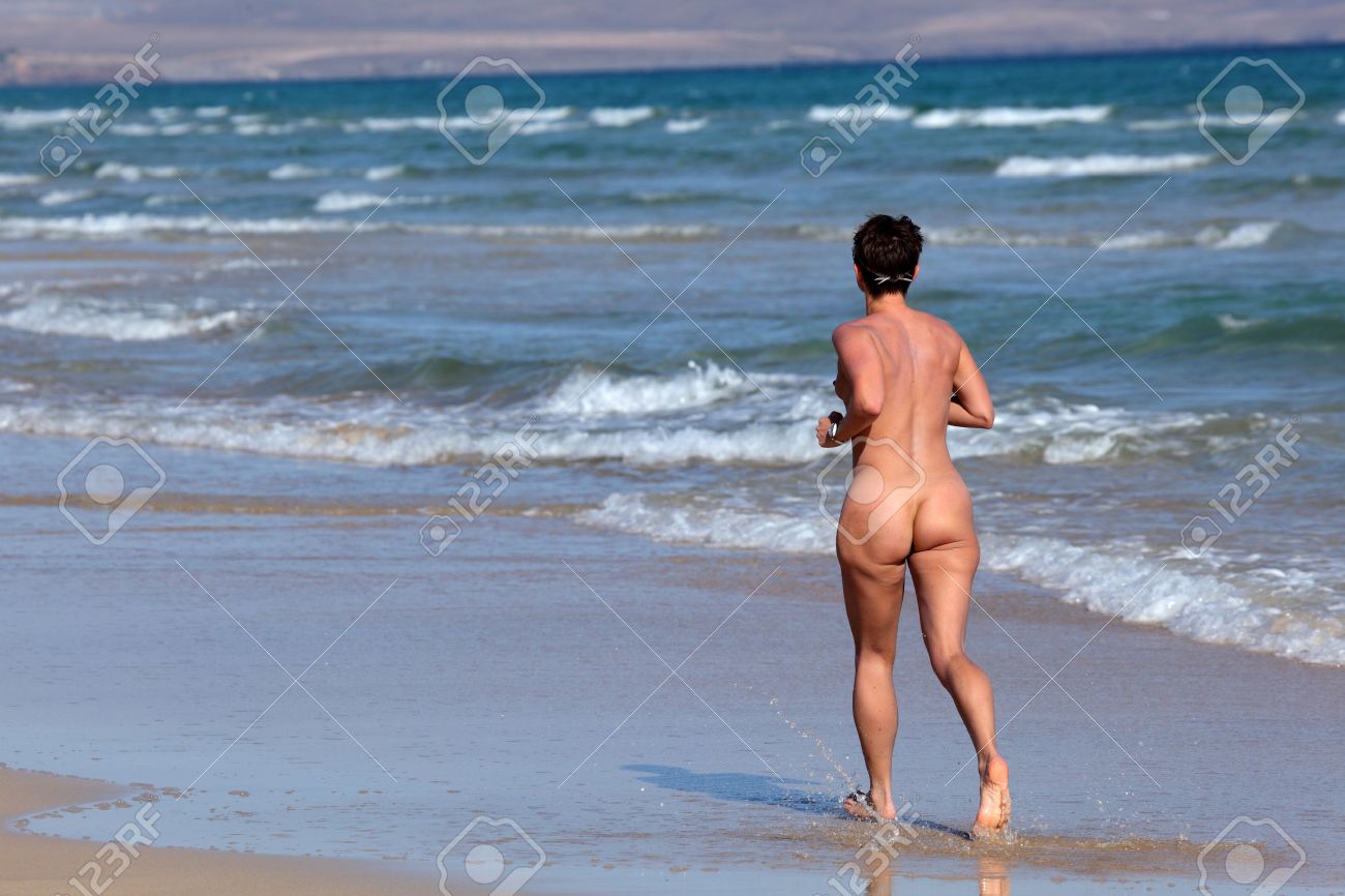 Nude woman in beach