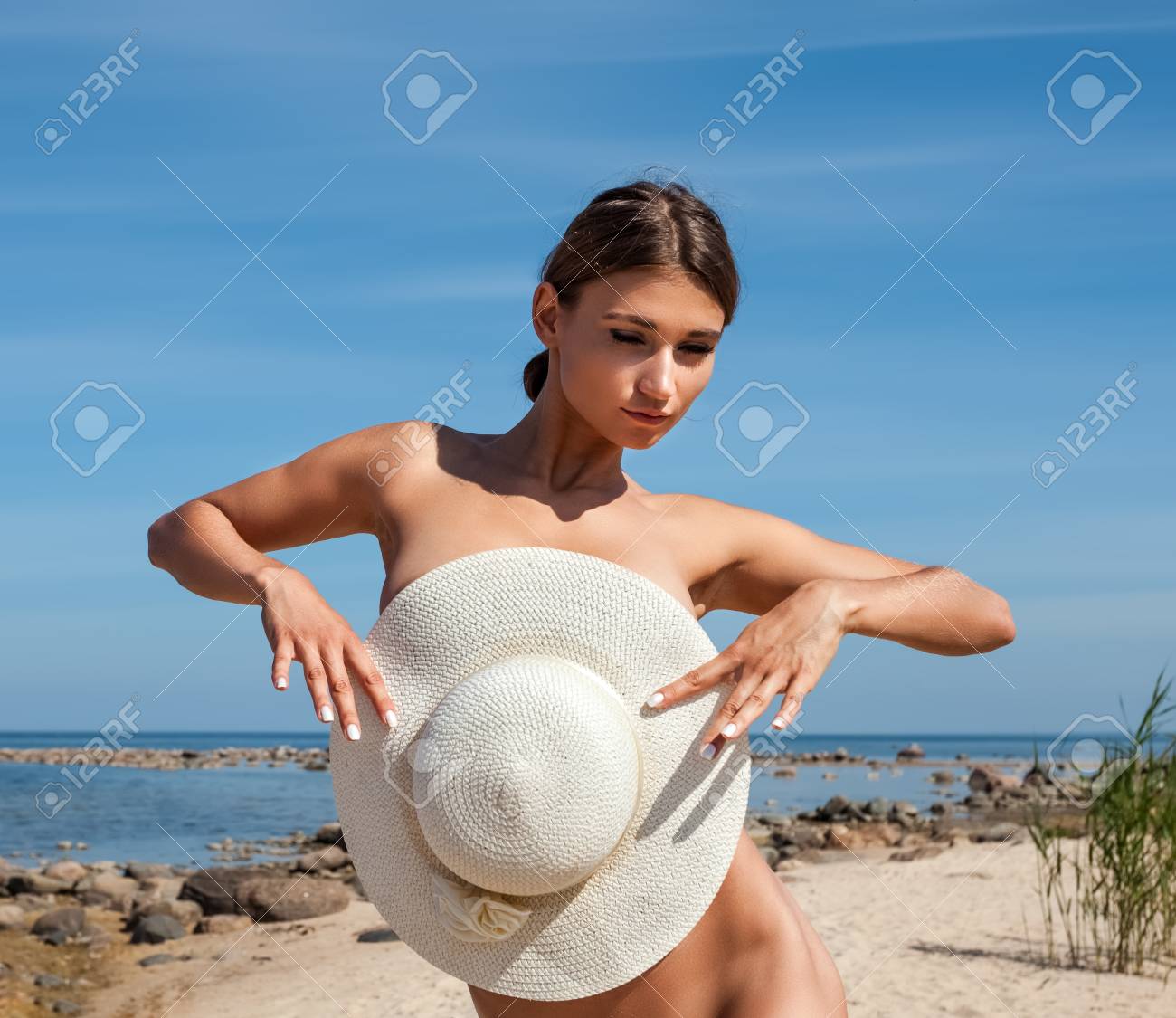 Nude woman in beach