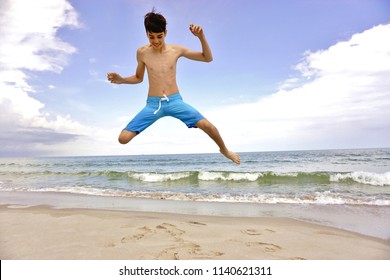 Nudist young beach boy
