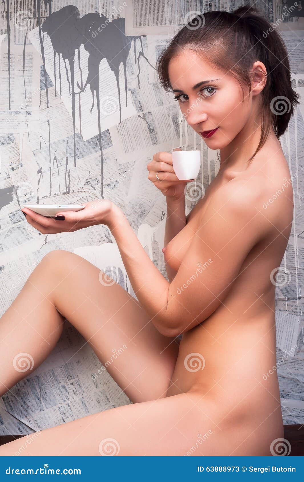 Naked woman drinking coffee