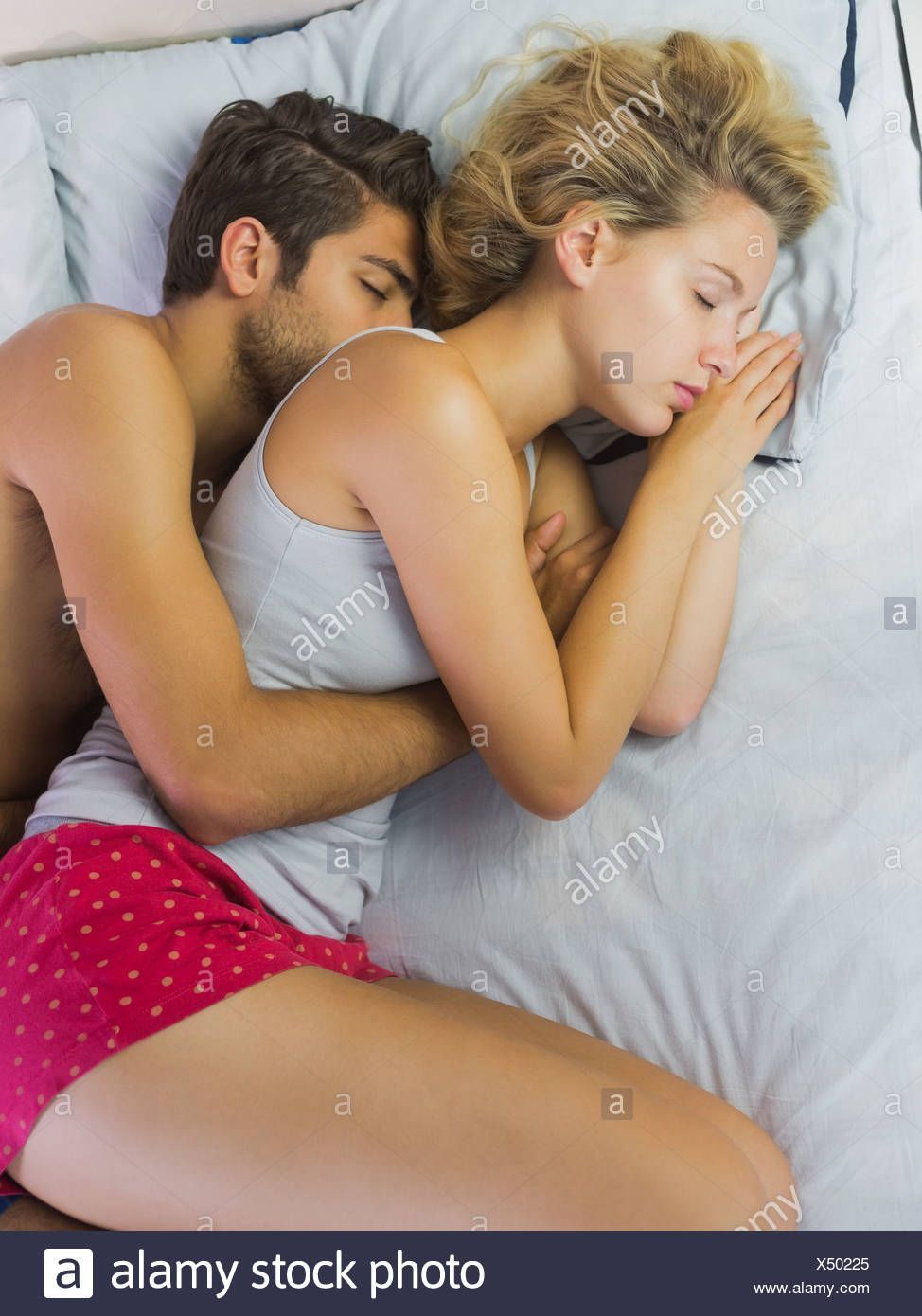 Boys with naked girls spooning