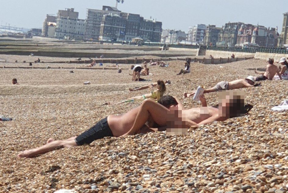 Nudist beach legs spread mature