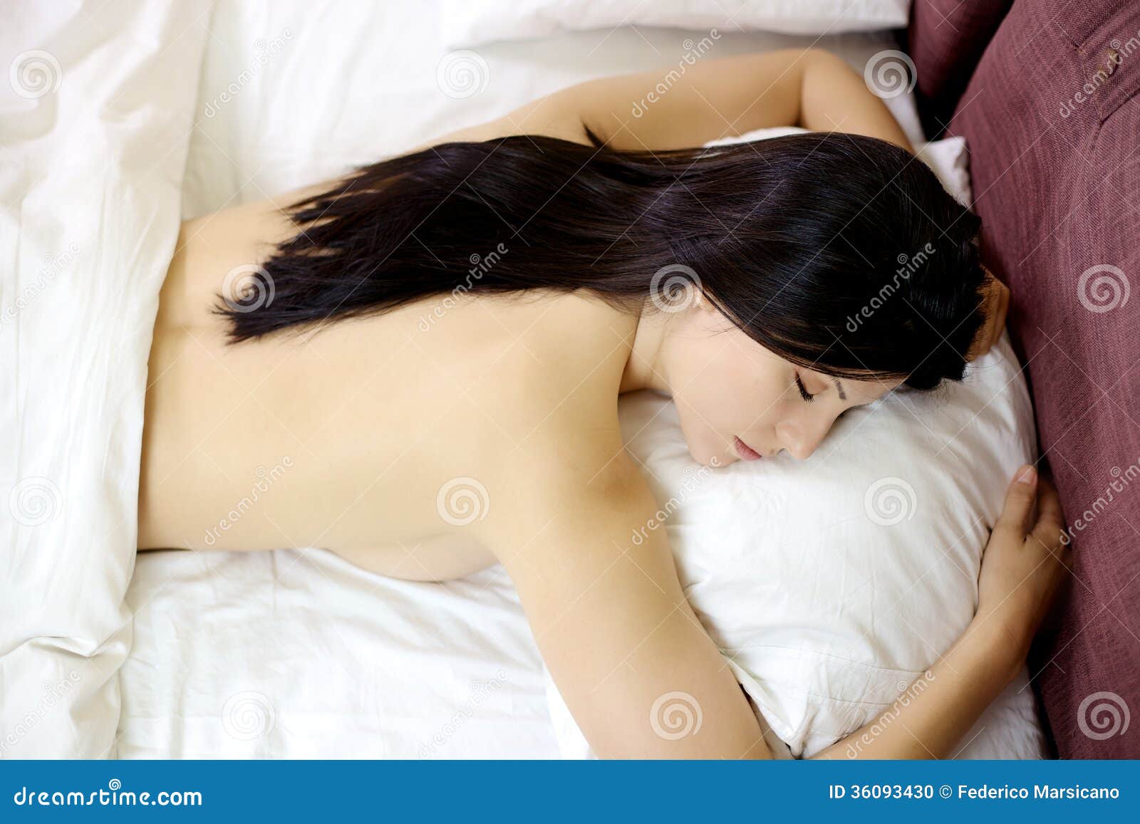 Cute naked women sleeping on bed